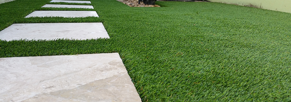 Our synthetic turf can be installed around pavers and stones for a custom and natural look.